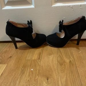 Black platform heels with bow.  Never worn.
